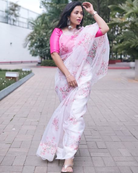 White Colour Orange Saree Paired With A Pink Blouse