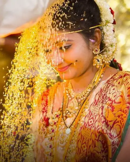 White Coloured Saree With Maroon Blouse For Talambralu Ceremony