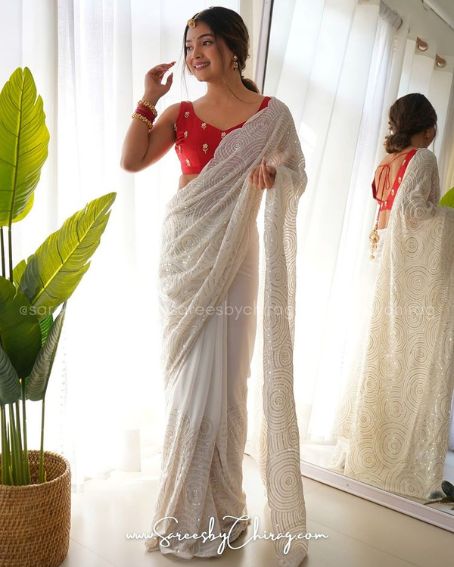 White Plain Saree with Red Sleeveless Blouse