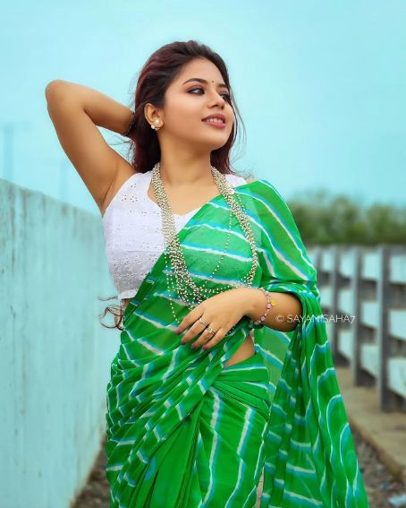 White Sleeveless Blouse With Green Saree