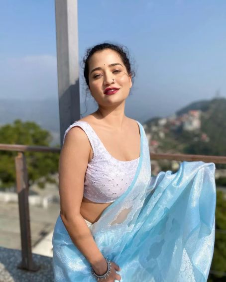 White Sleeveless Blouse with Sky Blue Saree