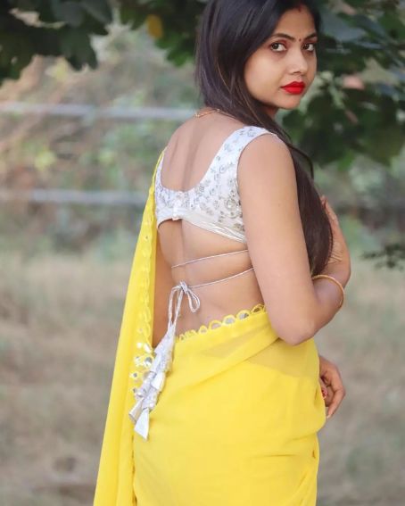 White Sleeveless Latkan Blouse with Yellow Saree