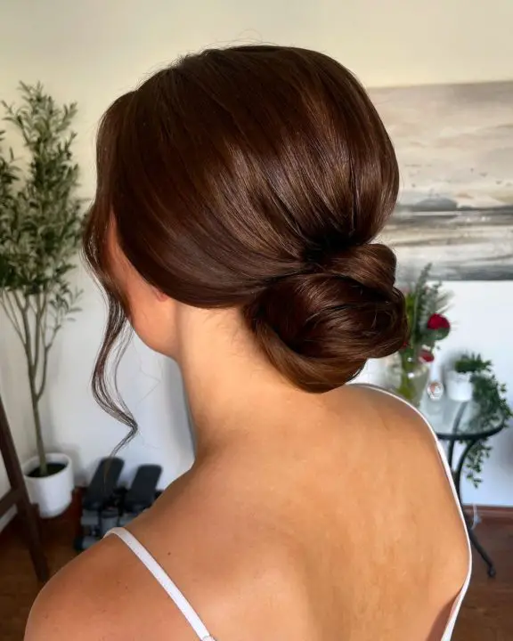 messy low bun updo hairstyle